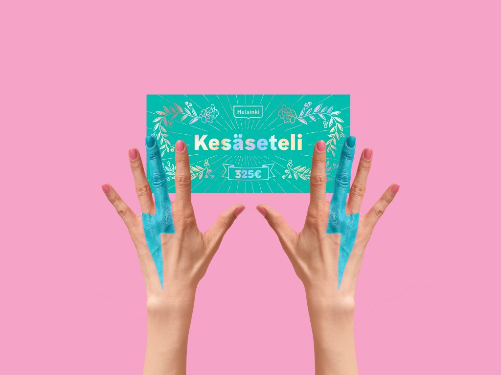 kaksi kättä pitelee kesäseteliä